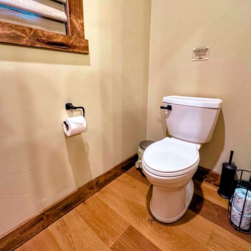 There is a private water closet in the master en suite bathroom.