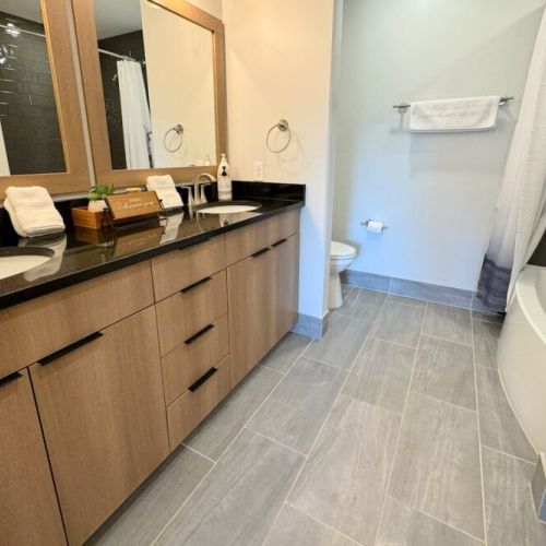 The master en suite bath has a large double vanity, and a tub/shower combo.