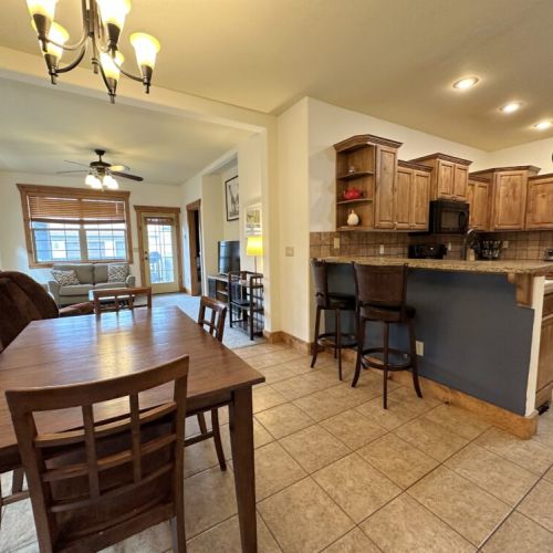 Whether you are cooking in the kitchen, eating at the dining table, or lounging in the living room, the open layout means you can always be a part of the fun in this condo.