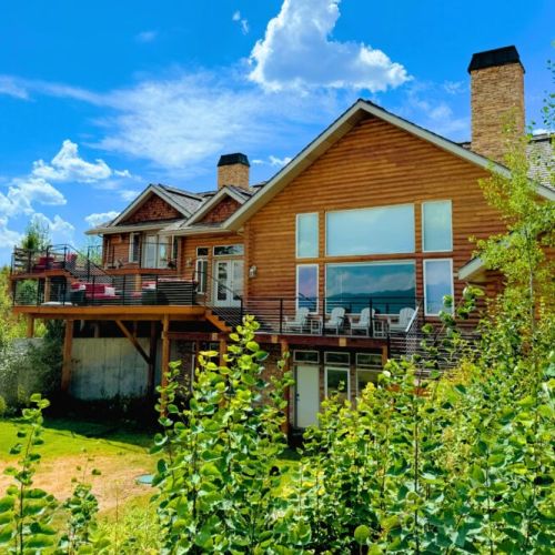 The expansive back deck is the perfect place to hang out with family, cook on the grill, and enjoy the spectacular view.