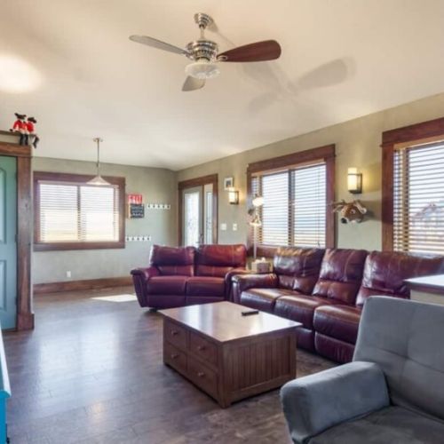 Kick back and relax in the living room, taking advantage of the cozy seating and a large TV.