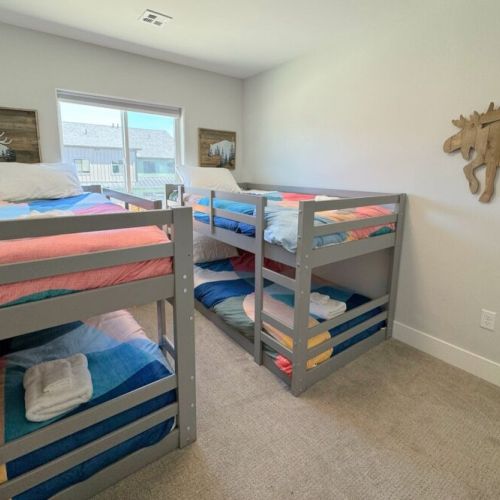 Bedroom #3 features four beds, all twins — perfect for kids!