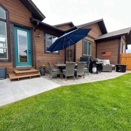 Make use of this robust outdoor space, which includes ample seating, a propane fire pit, a gas grill, and a hot tub.