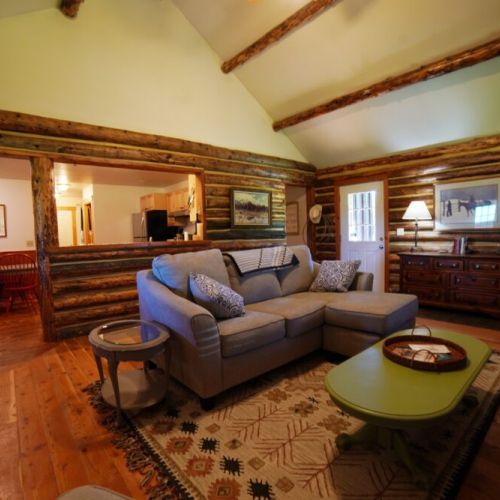 Unwind in the comfortable living room, with a TV, gas fireplace, and tall ceilings.