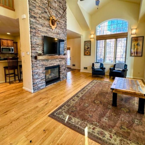 Kick back and relax in the living room, taking advantage of the inviting seating and a large smart TV.