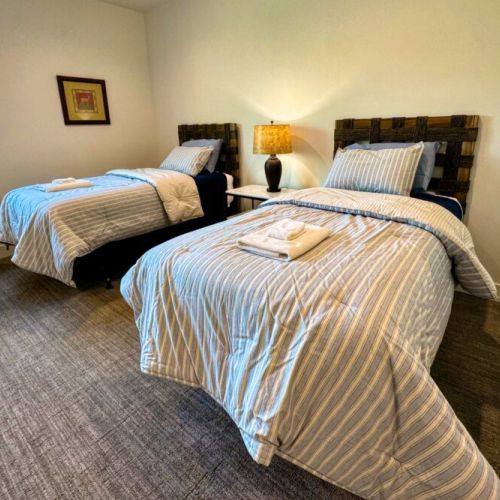 Bedroom #5 (upstairs) comes with 4 twin beds — perfect for kids! The room also enjoys an en suite.