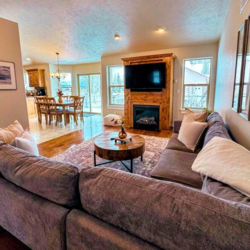 Relax in the living room after a day of play by lounging on the sofa in front of the gas fireplace or smart TV.