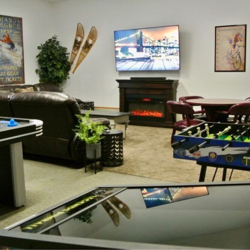 This entertainment room has all the amenities you'd need to have a night of family fun!