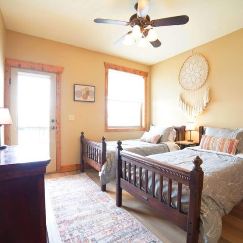 Bedroom #3 has two twin beds and access to a balcony shared with Bedroom #2.
