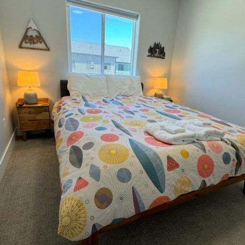 Bedroom #2 has a comfy queen bed, its own TV, and a roomy closet.