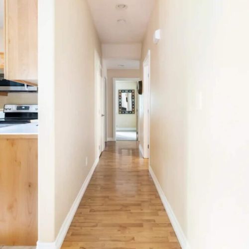 The bedrooms and bathrooms are just down the hallway from the main living area.