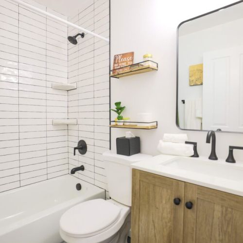 Bedrooms #2 and #3 share a full bathroom that comes equipped with a vanity and a large tub/shower combo.