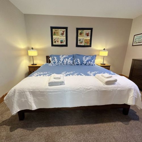 Bedroom #3, located at the far end of the basement, has a king bed.