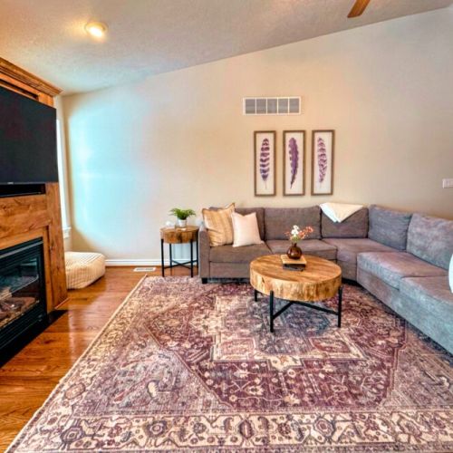 Relax in the living room after a day of play by lounging on the sofa in front of the gas fireplace or smart TV.