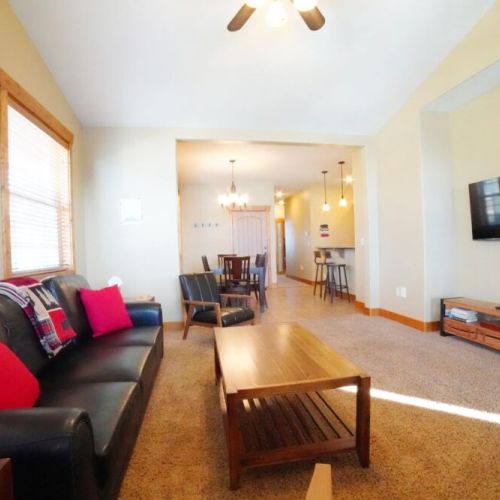 Chat at the island, lounge in the living room, or eat at the dining room table — this space is perfect for any guest's needs!