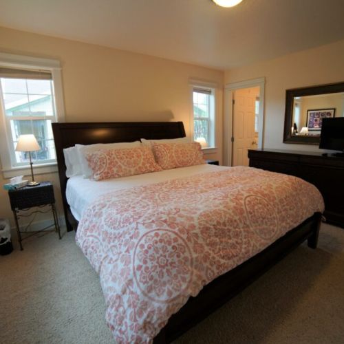 Master suite with king bed and attached bathroom.