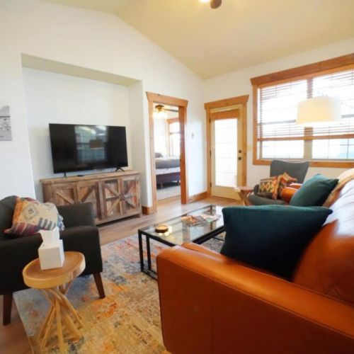 Kickback at the end of a day of skiing, hiking, or biking by relaxing in the cozy living room. Use the smart TV to access your preferred streaming service.