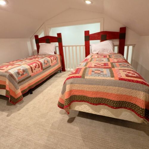 The kid's playroom also features two twin beds.