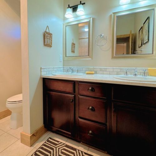 Bedrooms #2 and #3 share a full bathroom, complete with a double vanity and tub/shower combo.