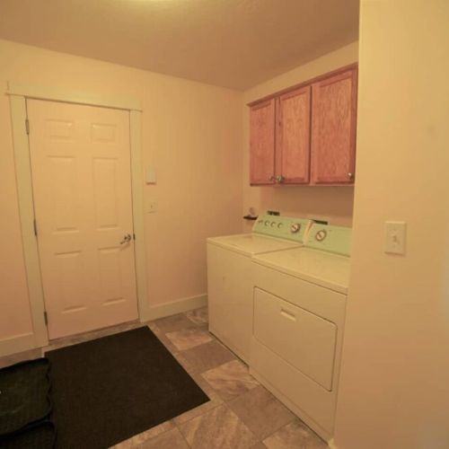 Laundry room off the garage to stay up on those dirty clothes.