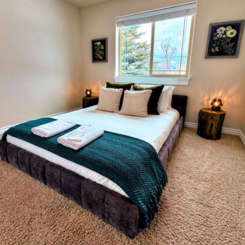 Bedroom #3, with its chic, boho styling, has a queen bed and a charming vibe.