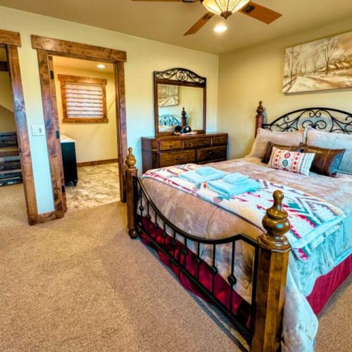 Bedroom #2 has a queen bed and an en suite bath — as well as a view of the Tetons.