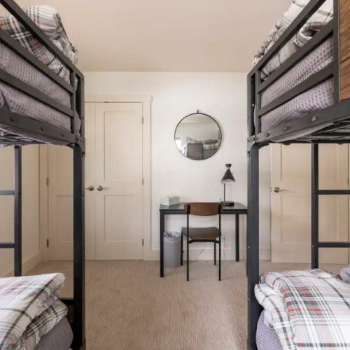 Bedroom #2 has two twin-over-twin bunk beds, made in an attractive mountain modern style.