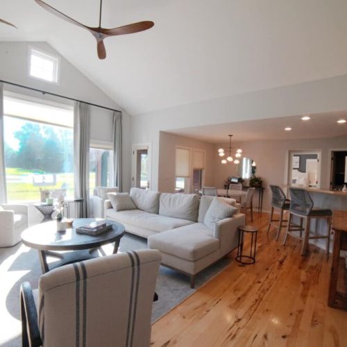 Whether you are relaxing in the living room, eating at the dining room table, or hanging in the kitchen, you are always a part of the fun in this home.