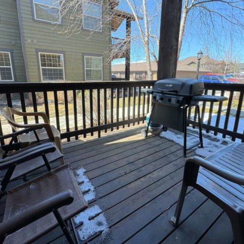 Step out of the living room onto the porch, and make use of the propane BBQ.