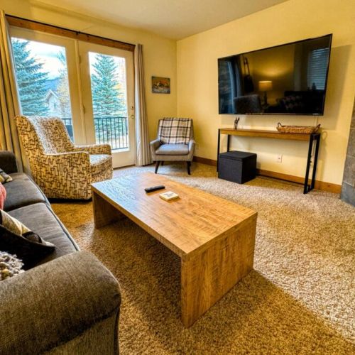 The living room also enjoys access to the front deck!