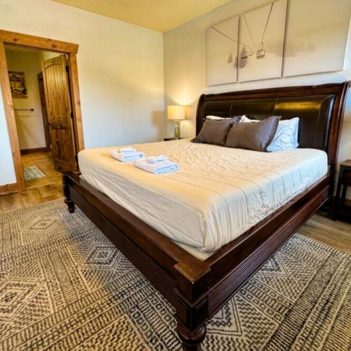 The master bedroom enjoys a king bed and an en suite bath.