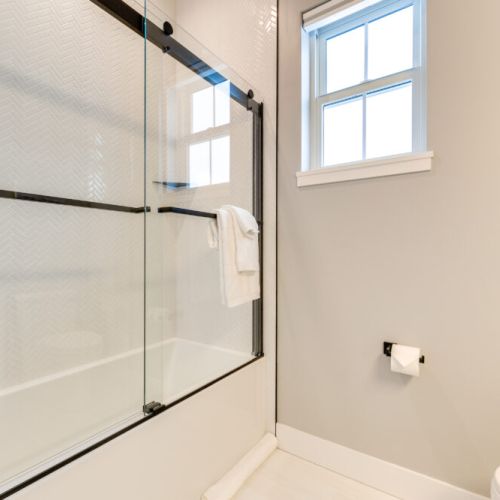 Bedrooms #2 and #3 share a full bathroom, which features a large vanity and a tub/shower combo.