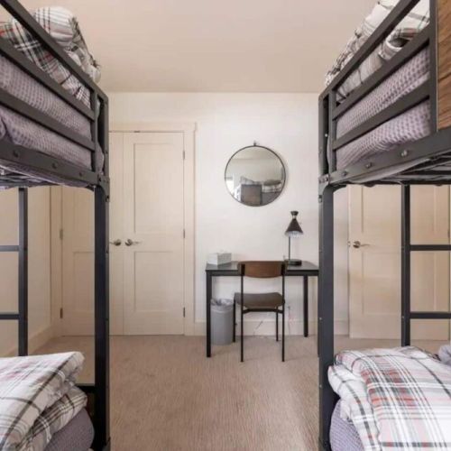 Bedroom #2 has two twin-over-twin bunk beds, made in an attractive mountain modern style.