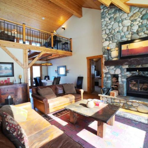Kick back and relax in the living room, taking advantage of the cozy seating and a lovely fireplace.