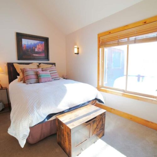 Bedroom #2, also on the main floor of the house, has a queen bed and has another lofted bedroom above it — perfect if you want to keep the kids close (but not too close).