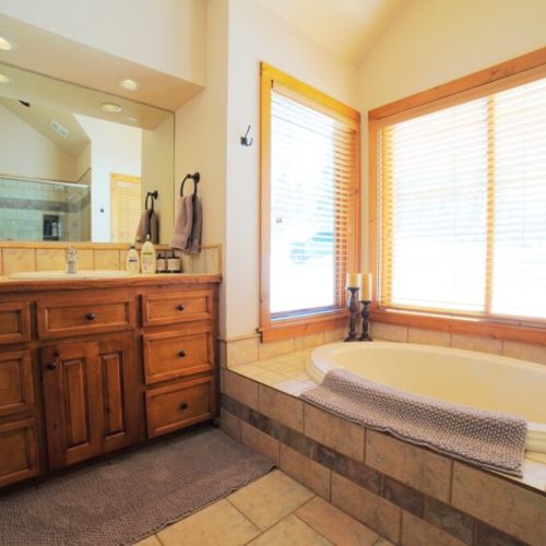 The master en suite has both a soaking tub and a walk-in shower.