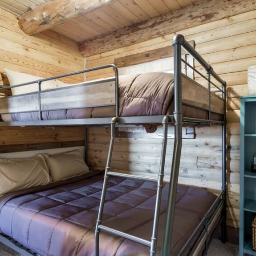 The full-over-queen bunk bed, located just off the kitchen, is perfect for families or larger groups.
