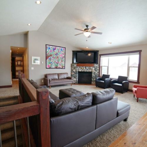The living room is also just off three upstairs bedrooms and the staircase to more fun downstairs!