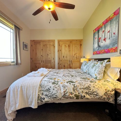 Bedroom #2 (located on the main level) has a queen bed, a large closet, and a view of the Big Hole Mountains to the west.