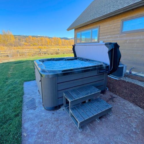 The private hot tub, located in the backyard, is a luxurious way to unwind after adventuring in the Tetons.