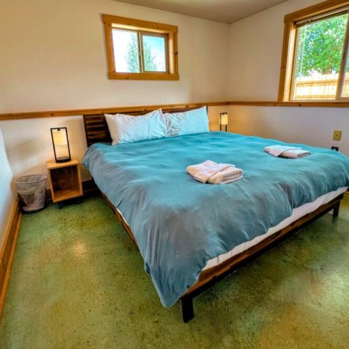 The other ground-floor bedroom also enjoys a spacious king bed.