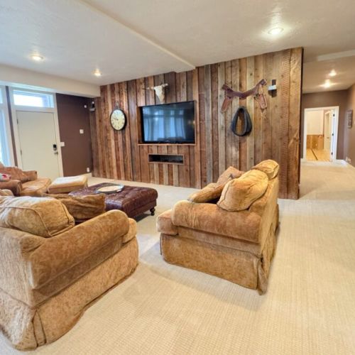 The downstairs living area has plenty of cozy seating and a smart TV.