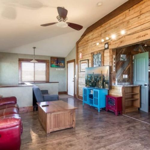Kick back and relax in the living room, taking advantage of the cozy seating and a large TV.
