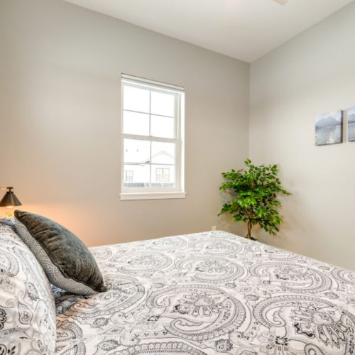 Bedroom #2 has a queen bed, beautiful natural light, and a closet for storing your belongings.