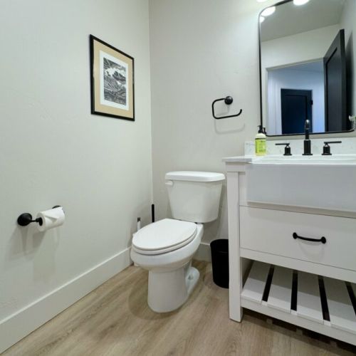 There is a powder room, located conveniently on the ground level of the townhome.