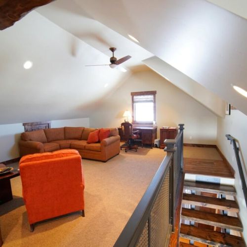 The upstairs features another common area, as well as a desk for work- or school-from-home.