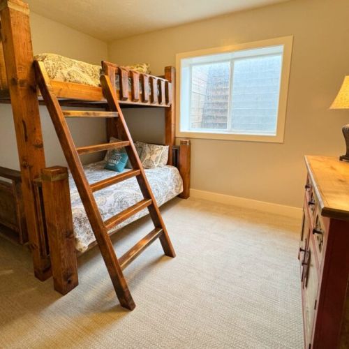 Bedroom #5 has a full-over-queen bunk bed and loads of storage space.