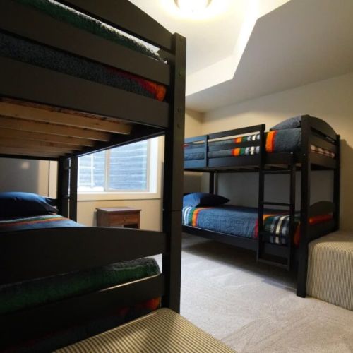 Bedroom #4, located in the basement, has two sets of twin-over-twin bunk beds — perfect for kids!