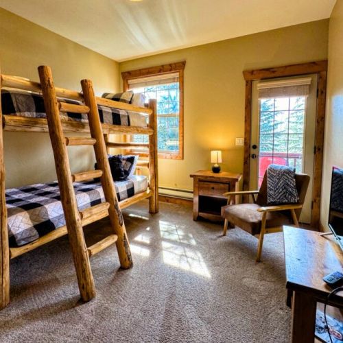 Bedroom #3 features a handmade twin-over-twin pine bunkbed — perfect for kids!