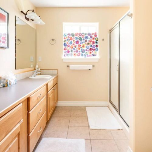 The master en suite enjoys a large double vanity and walk-in shower.
